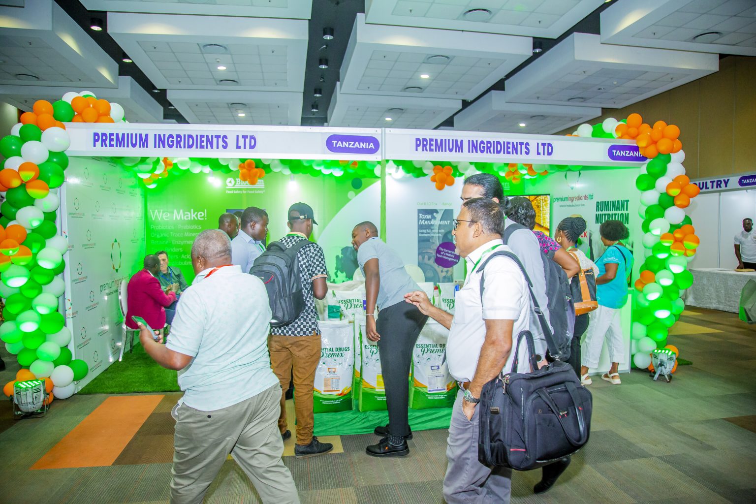 Visitors at an ingredients supplier exhibition stand.