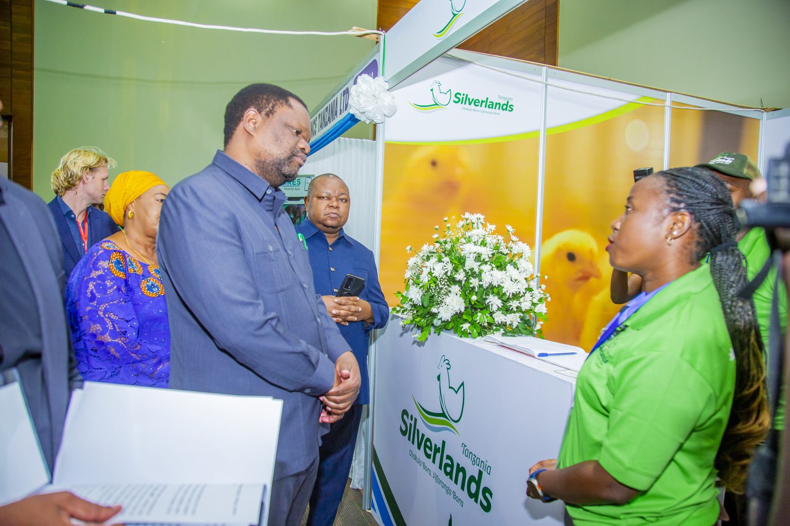 A delegation visiting a poultry company stand.